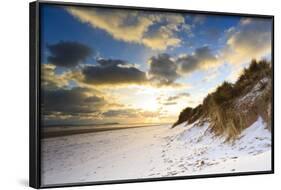 Man Walks Dog on Snow Covered Bamburgh Beach at Dawn with View to Farne Islands-Eleanor-Framed Photographic Print