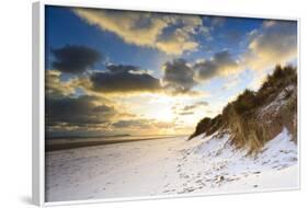 Man Walks Dog on Snow Covered Bamburgh Beach at Dawn with View to Farne Islands-Eleanor-Framed Photographic Print