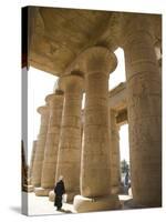 Man Walks Underneath the Giant Columns of the Hypostyle Hall in the Ramesseum, Luxor-Julian Love-Stretched Canvas