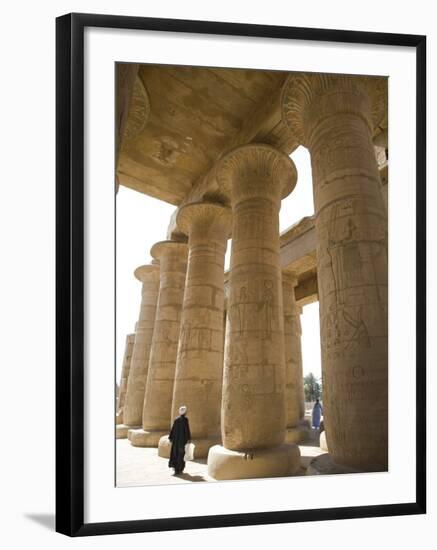 Man Walks Underneath the Giant Columns of the Hypostyle Hall in the Ramesseum, Luxor-Julian Love-Framed Photographic Print