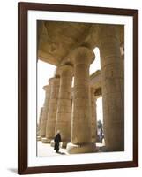 Man Walks Underneath the Giant Columns of the Hypostyle Hall in the Ramesseum, Luxor-Julian Love-Framed Photographic Print