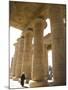 Man Walks Underneath the Giant Columns of the Hypostyle Hall in the Ramesseum, Luxor-Julian Love-Mounted Photographic Print