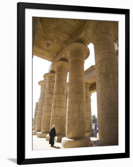 Man Walks Underneath the Giant Columns of the Hypostyle Hall in the Ramesseum, Luxor-Julian Love-Framed Photographic Print