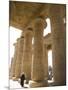 Man Walks Underneath the Giant Columns of the Hypostyle Hall in the Ramesseum, Luxor-Julian Love-Mounted Photographic Print