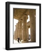 Man Walks Underneath the Giant Columns of the Hypostyle Hall in the Ramesseum, Luxor-Julian Love-Framed Photographic Print