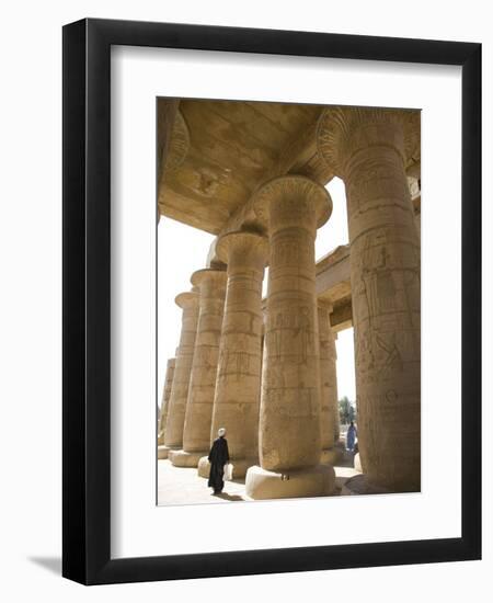 Man Walks Underneath the Giant Columns of the Hypostyle Hall in the Ramesseum, Luxor-Julian Love-Framed Photographic Print