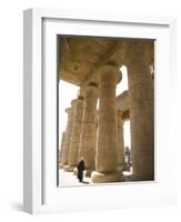 Man Walks Underneath the Giant Columns of the Hypostyle Hall in the Ramesseum, Luxor-Julian Love-Framed Photographic Print