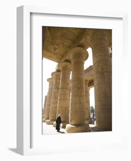 Man Walks Underneath the Giant Columns of the Hypostyle Hall in the Ramesseum, Luxor-Julian Love-Framed Photographic Print