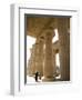 Man Walks Underneath the Giant Columns of the Hypostyle Hall in the Ramesseum, Luxor-Julian Love-Framed Photographic Print