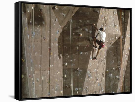 Man Wall Climbing Indoors with Equipment-null-Framed Stretched Canvas