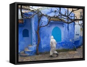 Man Wearing a Djellaba on the Street, Chefchaouen, Morocco-Peter Adams-Framed Stretched Canvas
