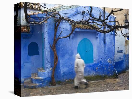 Man Wearing a Djellaba on the Street, Chefchaouen, Morocco-Peter Adams-Stretched Canvas