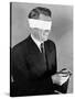 Man Wearing Blindfold Holding Money (B&W)-Hulton Archive-Stretched Canvas