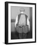 Man Wearing Coat Holding Bottles-null-Framed Photographic Print