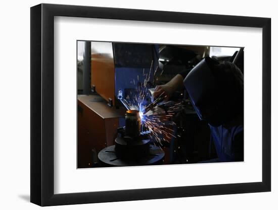 Man Welding Workpiece, Workshop, Flying Sparks-Fact-Framed Photographic Print