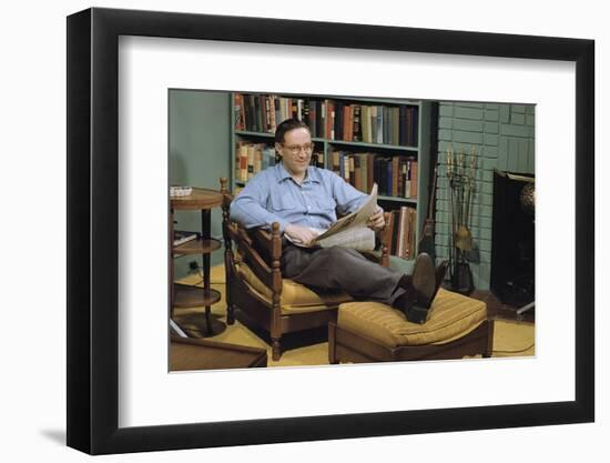 Man with a Newspaper at Home-William P. Gottlieb-Framed Photographic Print