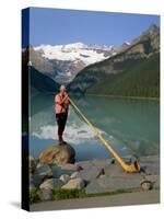 Man with an Alpenhorn Beside Lake Louise in the Banff National Park, Alberta, Canada, North America-Renner Geoff-Stretched Canvas