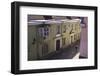 Man with Hat in Old Street with Pink and Yellow Coloured Buildings, Tallinn, Estonia, Europe-Eleanor-Framed Photographic Print