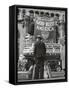 Man with Shopping Bags in Front of Million Dollar Theatre Emblazoned with God Bless America Banner-Bob Landry-Framed Stretched Canvas