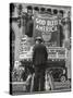 Man with Shopping Bags in Front of Million Dollar Theatre Emblazoned with God Bless America Banner-Bob Landry-Stretched Canvas