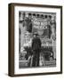 Man with Shopping Bags in Front of Million Dollar Theatre Emblazoned with God Bless America Banner-Bob Landry-Framed Photographic Print