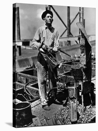 Man Working in the Shipbuilding Industry-George Strock-Stretched Canvas