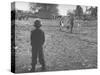 Man Working on the Farm after it Has Rained-null-Stretched Canvas