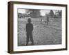 Man Working on the Farm after it Has Rained-null-Framed Photographic Print