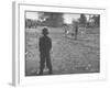 Man Working on the Farm after it Has Rained-null-Framed Photographic Print