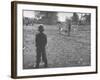 Man Working on the Farm after it Has Rained-null-Framed Photographic Print