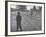 Man Working on the Farm after it Has Rained-null-Framed Photographic Print