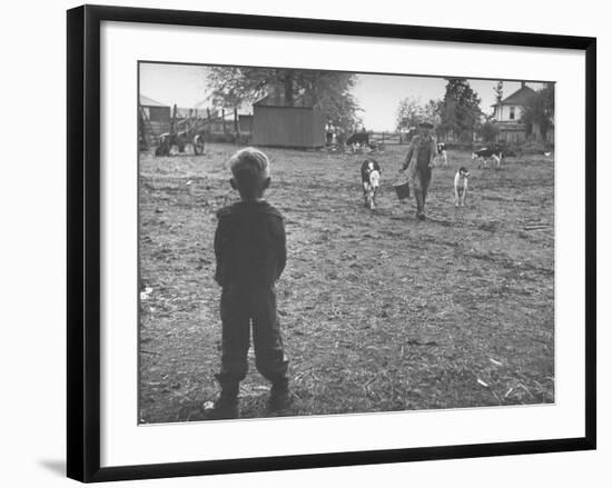 Man Working on the Farm after it Has Rained-null-Framed Photographic Print