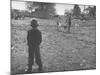 Man Working on the Farm after it Has Rained-null-Mounted Photographic Print