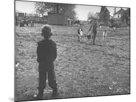 Man Working on the Farm after it Has Rained-null-Mounted Photographic Print