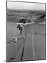 Man Working on the Texas Illinois Natural Gas Company's Pipeline Suspension Bridge-John Dominis-Mounted Photographic Print