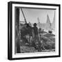 Man Working with Irrigation System as Sailboats Sit at Edge of Nile River at Wadi Halfa-null-Framed Photographic Print