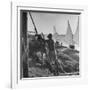 Man Working with Irrigation System as Sailboats Sit at Edge of Nile River at Wadi Halfa-null-Framed Photographic Print