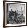 Man Working with Irrigation System as Sailboats Sit at Edge of Nile River at Wadi Halfa-null-Framed Photographic Print