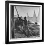 Man Working with Irrigation System as Sailboats Sit at Edge of Nile River at Wadi Halfa-null-Framed Photographic Print