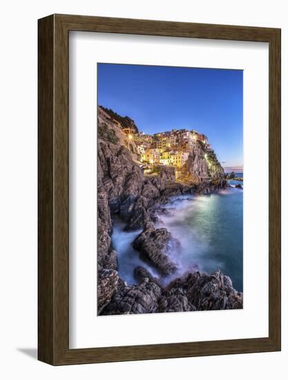 Manarola Village Illuminated by the Blue Light of Dusk with its Typical Pastel Colored Houses-ClickAlps-Framed Photographic Print