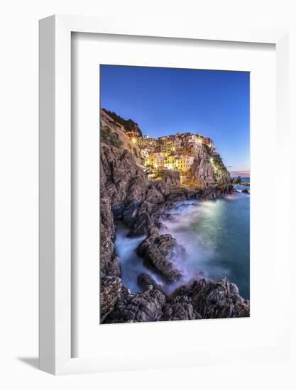 Manarola Village Illuminated by the Blue Light of Dusk with its Typical Pastel Colored Houses-ClickAlps-Framed Photographic Print