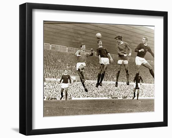 Manchester United vs. Arsenal, Football Match at Old Trafford, October 1967-null-Framed Premium Photographic Print