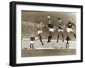 Manchester United vs. Arsenal, Football Match at Old Trafford, October 1967-null-Framed Premium Photographic Print