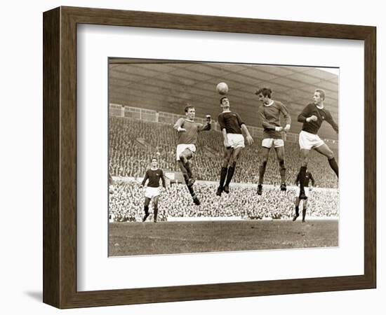 Manchester United vs. Arsenal, Football Match at Old Trafford, October 1967-null-Framed Premium Photographic Print