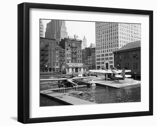 Manhattan's East River Downtown Skyport - Grumman and Fairchild Amphibious Planes-Margaret Bourke-White-Framed Photographic Print