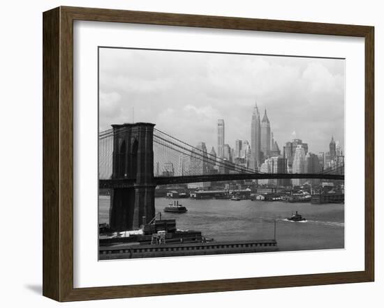 Manhattan Skyline And Brooklyn Bridge-Bettmann-Framed Premium Photographic Print