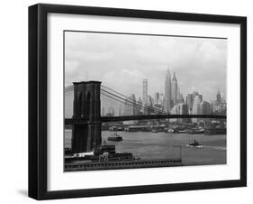 Manhattan Skyline And Brooklyn Bridge-Bettmann-Framed Photographic Print