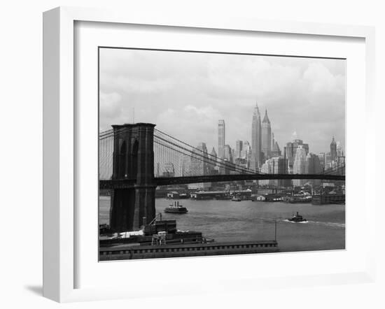 Manhattan Skyline And Brooklyn Bridge-Bettmann-Framed Photographic Print