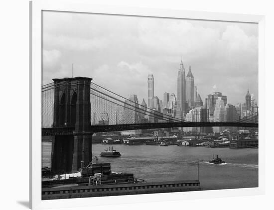 Manhattan Skyline And Brooklyn Bridge-Bettmann-Framed Photographic Print