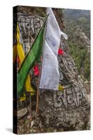 Mani Stone and prayer flags along a trail, Nepal.-Lee Klopfer-Stretched Canvas